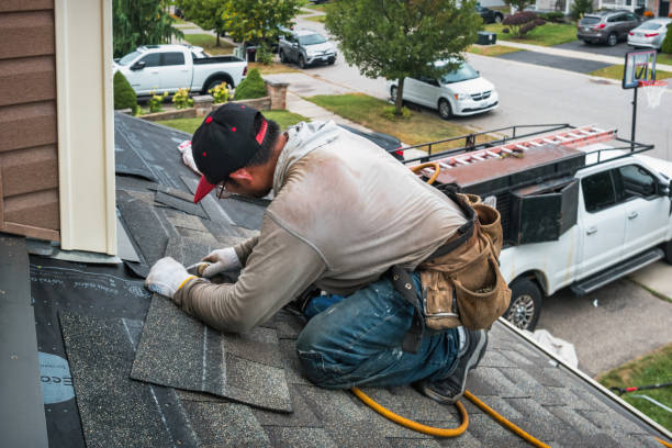 Professional Storm Damage Roof Repair technician working in Oskaloosa, IA